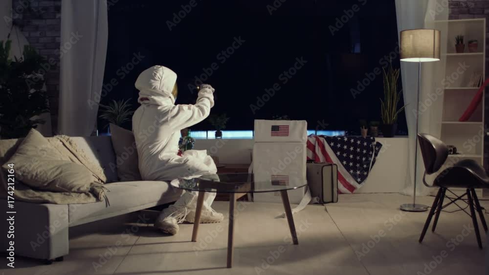 Spaceman astronaut relaxing in space station Spaceman astronaut relaxing in space station