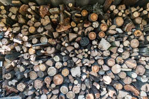 cut round logs - firewood stack background pattern