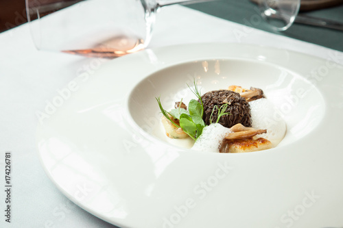 stuffed morels under truffle sauce