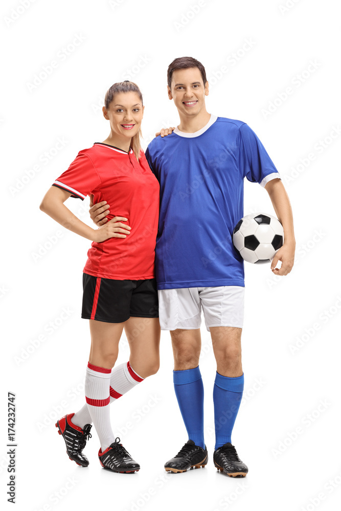 Female soccer player and a male soccer player Female soccer player and a male soccer player