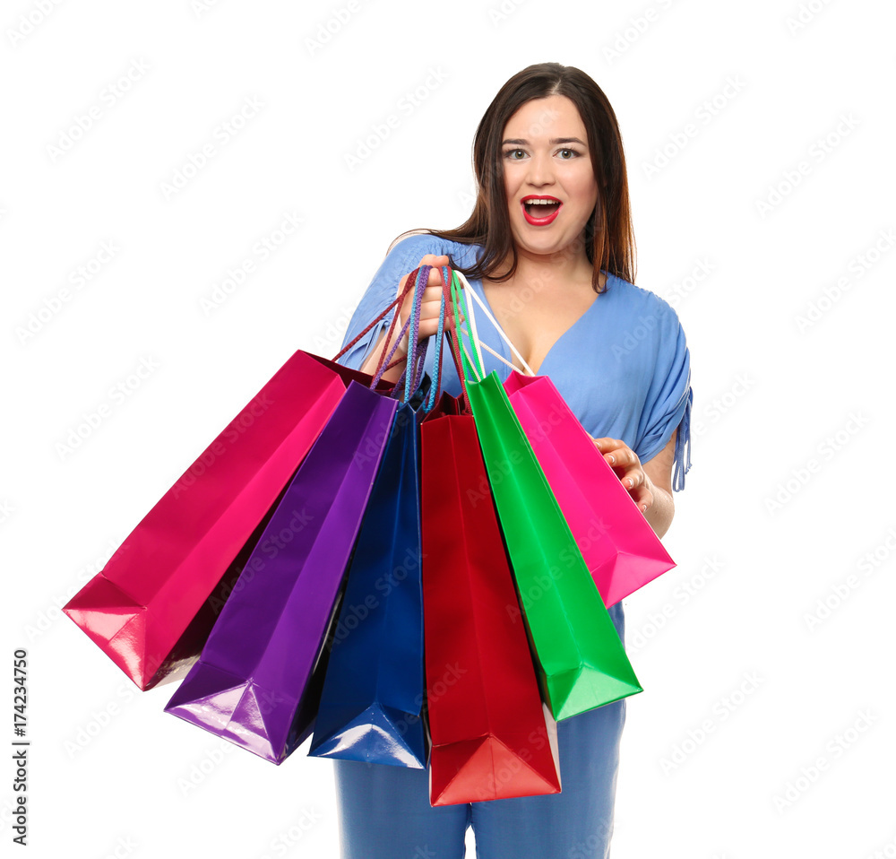 Beautiful stylish overweight woman with shopping bags on white background Beautiful stylish overweight woman with shopping bags on white background