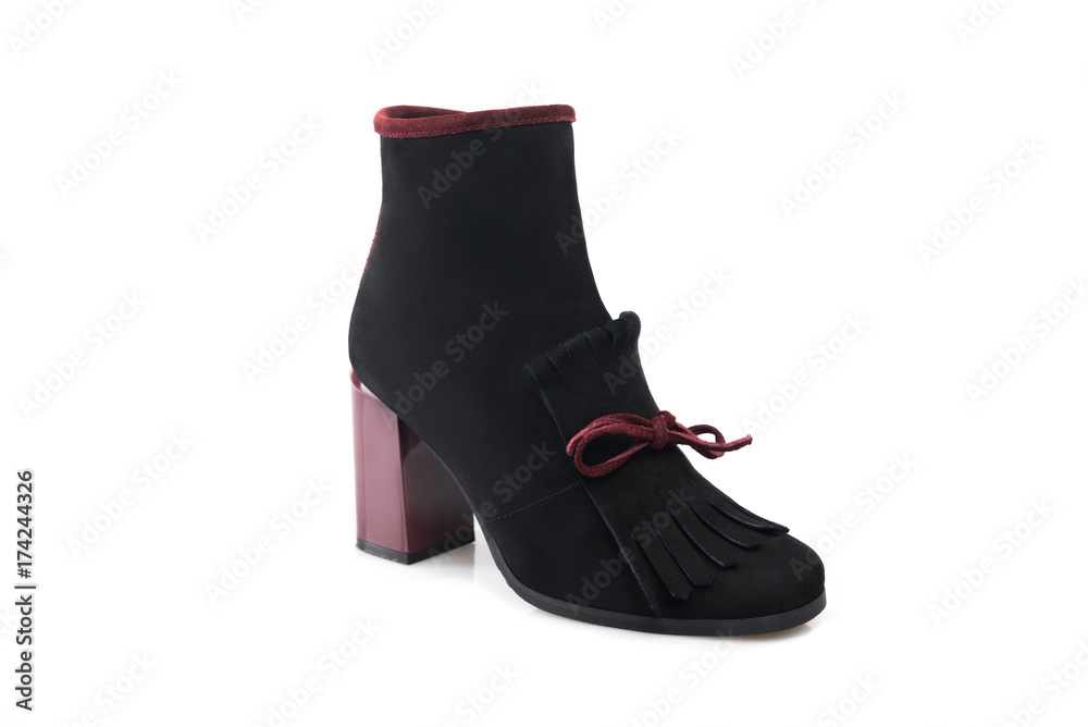 Black suede boot isolated on white background. Black suede boot isolated on white background.