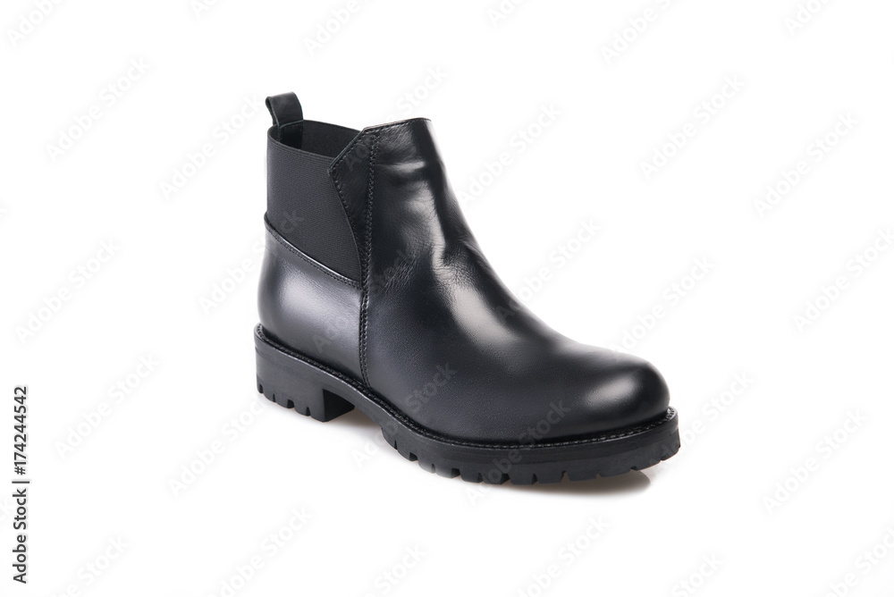 Black suede boot isolated on white background. Black suede boot isolated on white background.