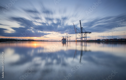 Southampton Docks viewed from Marchwood at sunset. photo