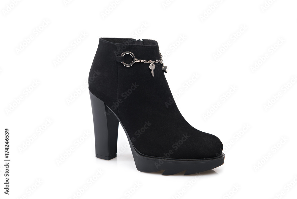 Black suede boot isolated on white background. Black suede boot isolated on white background.