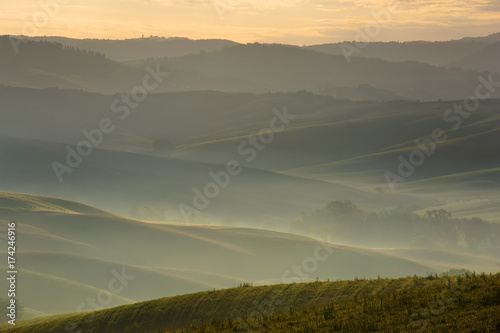 Tuscany foggy morning farmland hill landscape