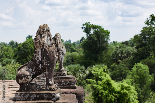 Two stone lions guarding Pre Rup temple terrace in Angkor Wat