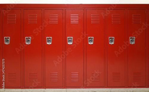 Photo close up on red lockers in gym