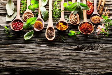 Papier peint photo Cuisine Herbs and spices on a old wooden background  © Dionisvera