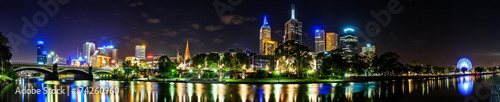 A beautiful view of Melbourne downtown across the Yarra river at night in Melbourne, Victoria, Australia.