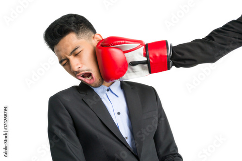 Businessman punch for competition concept