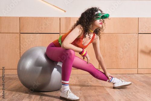 stylish woman with fitness ball