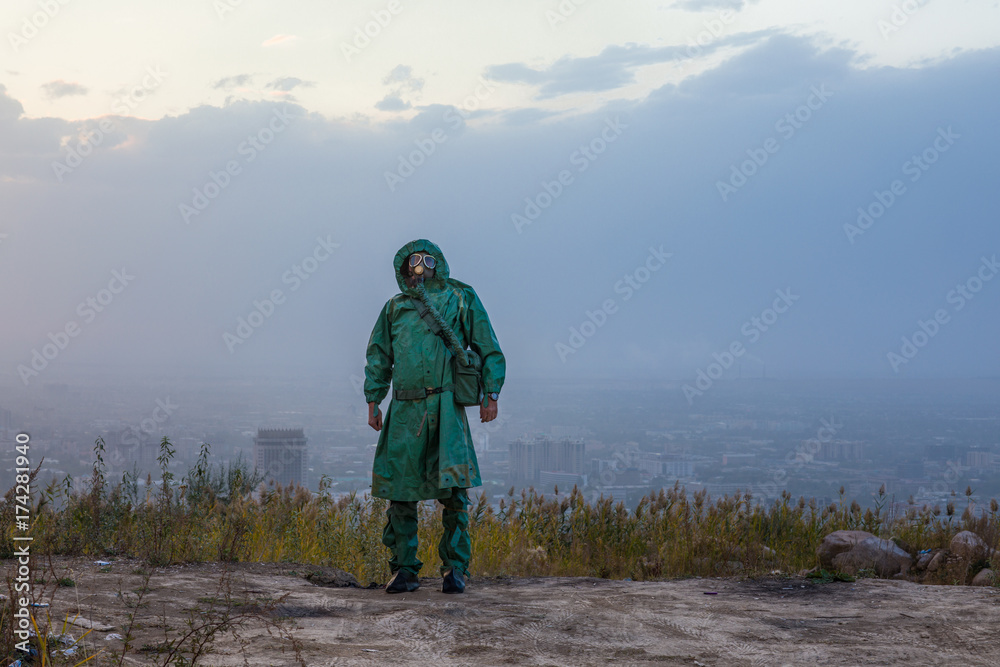 stalker,man in a gas mask in a polluted city