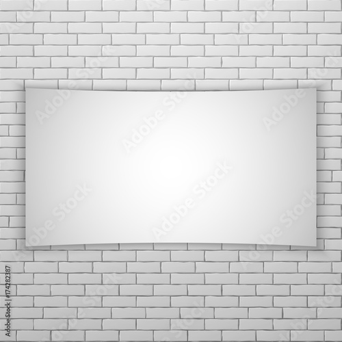 White movie screen or banner on white brick wall