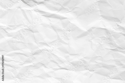 The texture of white paper with dents and kinks. Background of the rumpled surface.