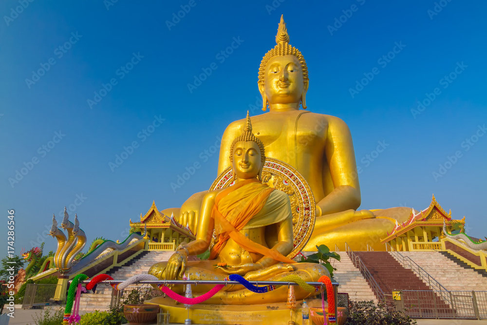 The famous biggest golden buddha statue at Wat muang, Angthong province, Thailand. The famous biggest golden buddha statue at Wat muang, Angthong province, Thailand.