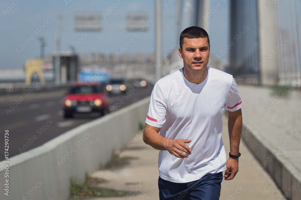 Jogger running on bridge