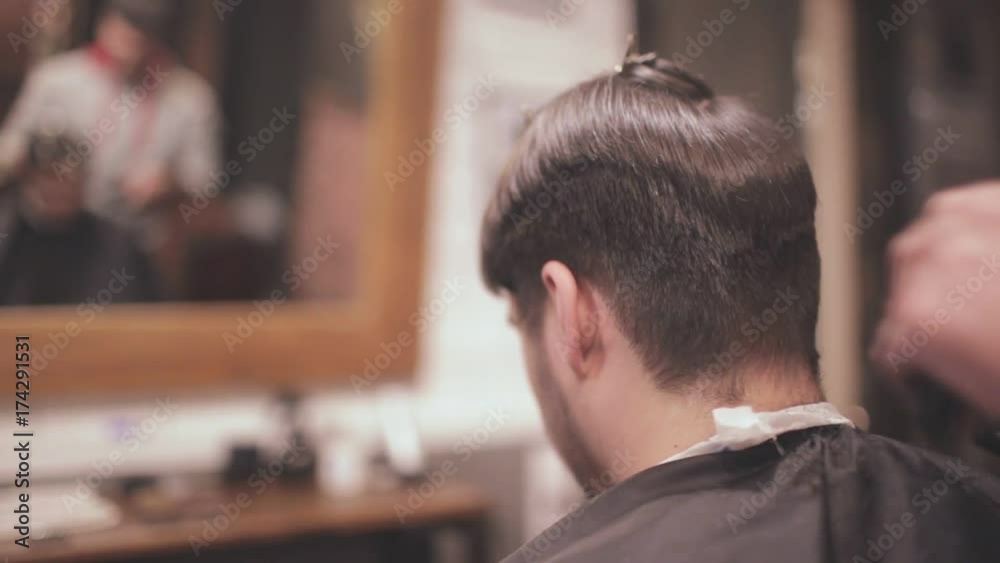 Barber haircut. Man hairstyle. Close up of barber hair cut with electric razor. Male hairdresser using electric shaver. Man haircut with hair clipper. Hairstyling in barbershop Barber haircut. Man hairstyle. Close up of barber hair cut with electric razor. Male hairdresser using electric shaver. Man haircut with hair clipper. Hairstyling in barbershop