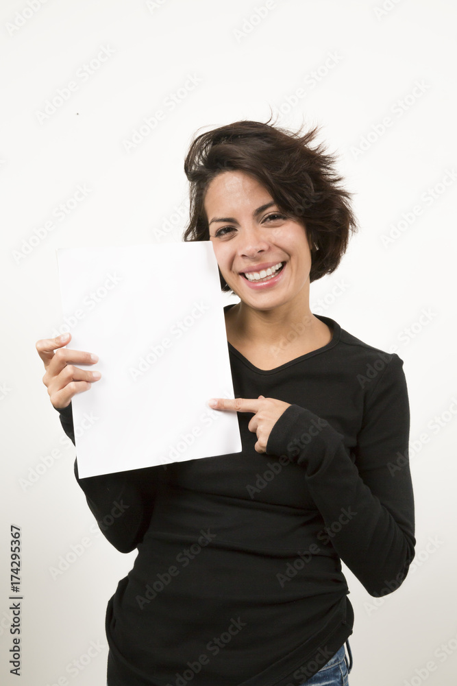 Beautiful young woman holding a blank sheet of paper Beautiful young woman holding a blank sheet of paper