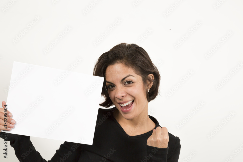 Beautiful young woman holding a blank sheet of paper Beautiful young woman holding a blank sheet of paper
