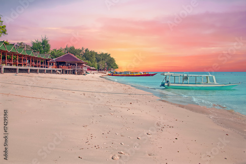 Traditional boat on Gili Meno beach in Indonesia, Asia at sunset photo