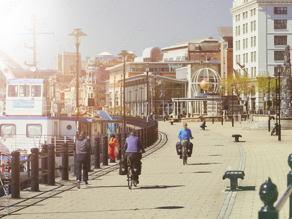 NEWCASTLE UPON TYNE, ENGLAND, UK - MAY 17, 2017: Cyclists and Pedestrians on Newcastle Quayside.