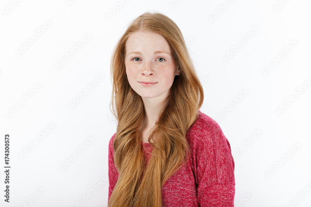 Beauty portrait of young adorable fresh looking redhead woman with gorgeous extra long hair. Emotion and facial expression concept. Beauty portrait of young adorable fresh looking redhead woman with gorgeous extra long hair. Emotion and facial expression concept.