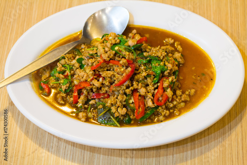 stir-fried with minced pork and basil on white plate (Ka Prao Moo)