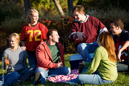 Football: Group of Friends Having Picnic in Park