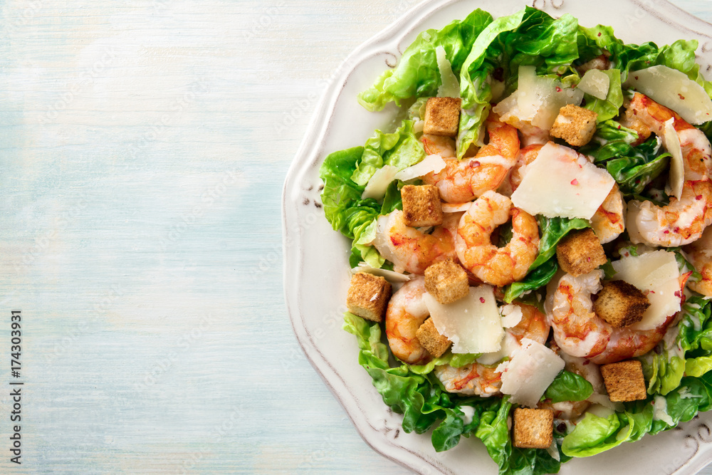 Overhead photo of shrimp Caesar salad with copyspace Overhead photo of shrimp Caesar salad with copyspace