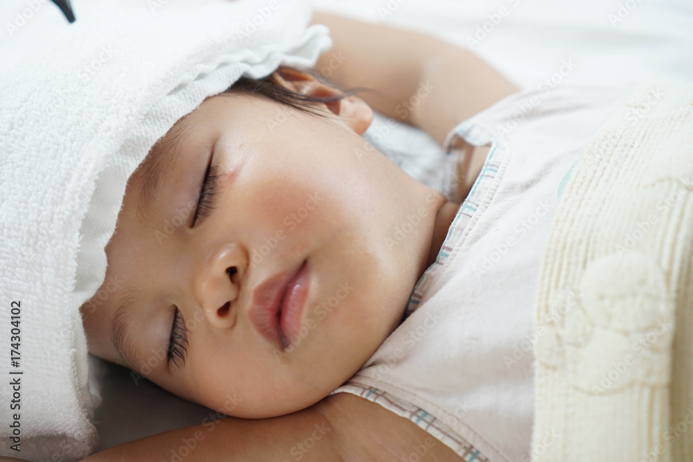 Toddler asian girl sleeping 1.8 years old portrait, child sleep tight day time, recuperation because of sickness Toddler asian girl sleeping 1.8 years old portrait, child sleep tight day time, recuperation because of sickness
