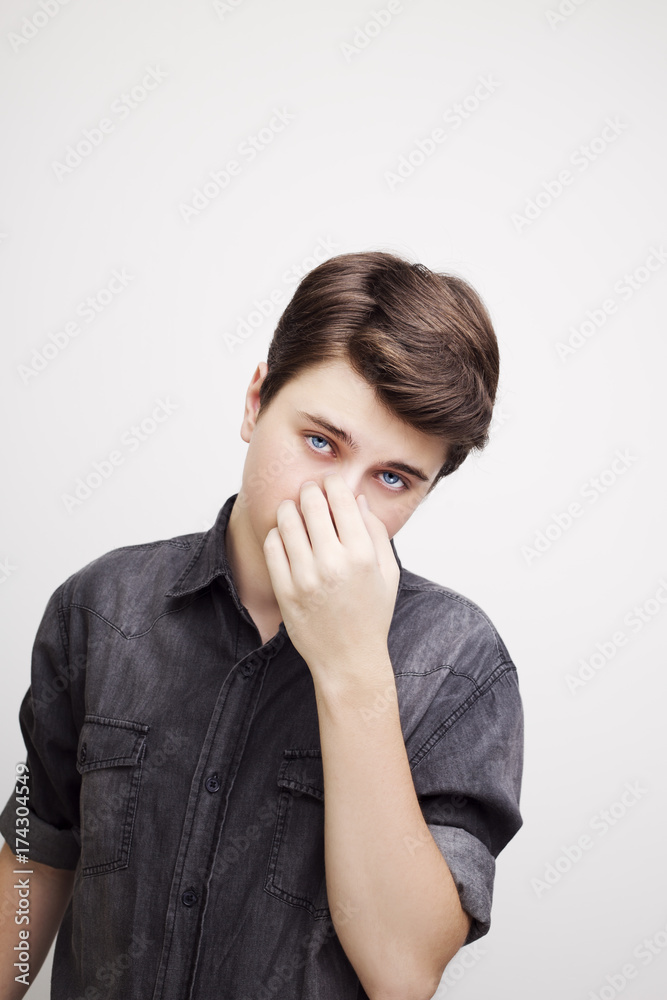 Stylish handsome young man posing. Studio shot on white background Stylish handsome young man posing. Studio shot on white background
