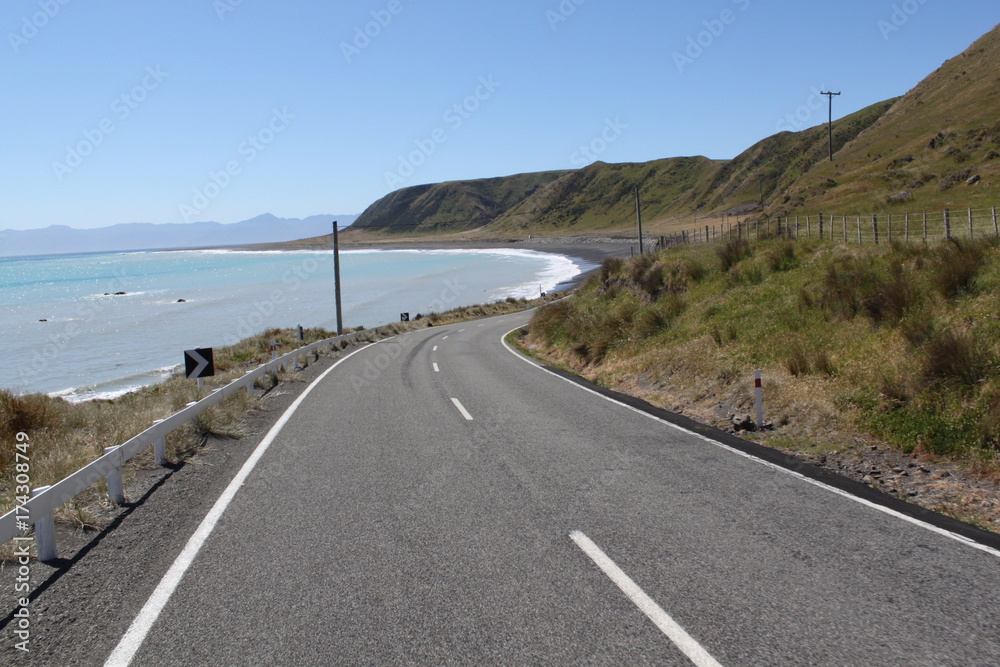 Road curves gently along the coast Road curves gently along the coast