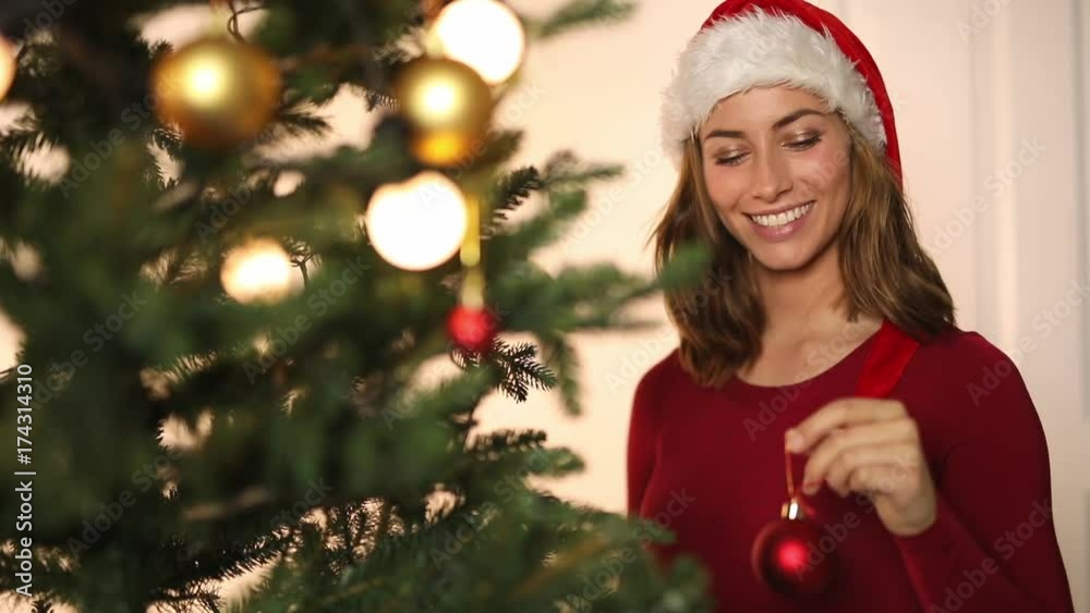 Santa girl decorating tree Santa girl decorating tree