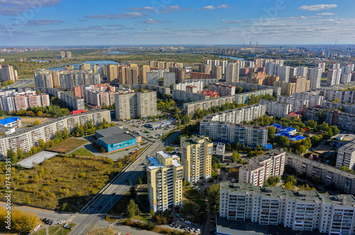 Tyumen, Russia - September 26, 2017: Aerial view onto 1st Zarechny residential district and Zdorovye fitness complex photo