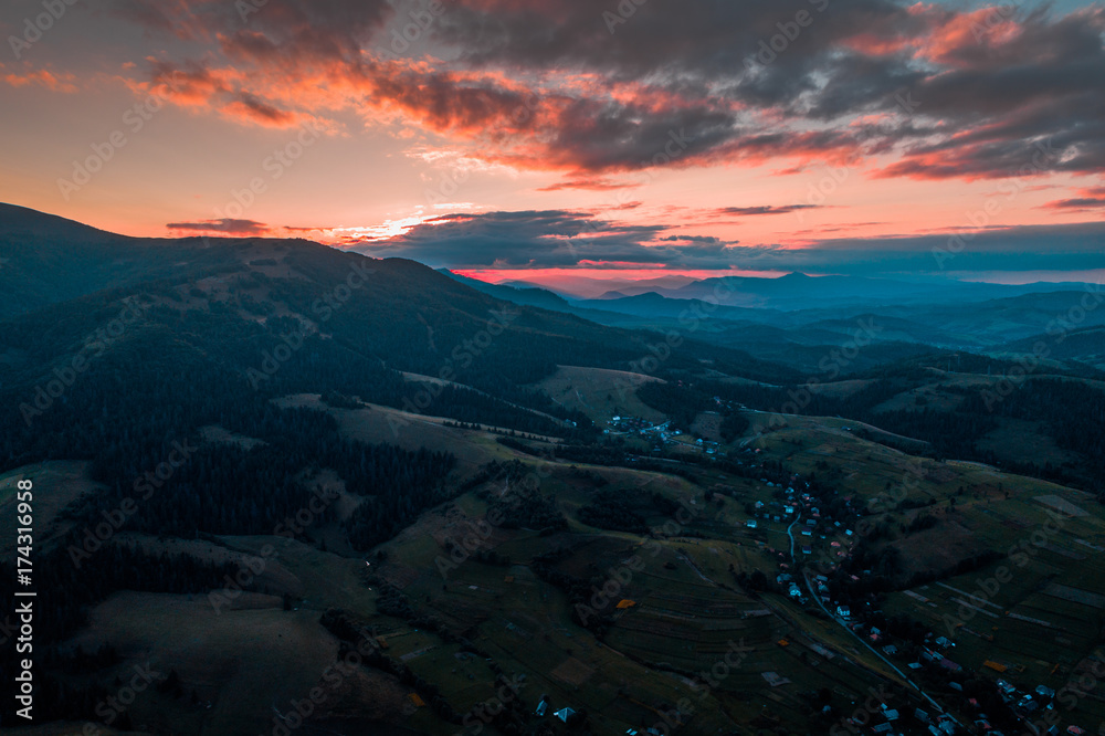 Aerial view of the village in the Carpathian mountains on the Sunset Aerial view of the village in the Carpathian mountains on the Sunset