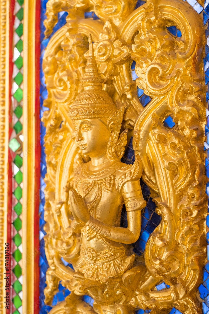 Thai golden statue with beautiful traditional texture.