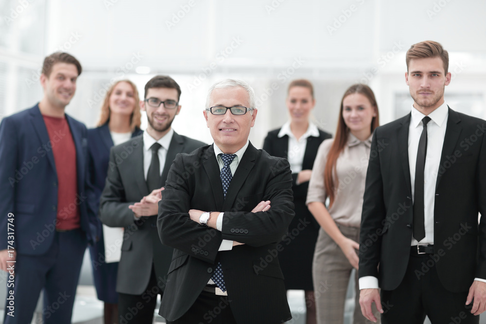 portrait of senior businessman and employees of the company. portrait of senior businessman and employees of the company.
