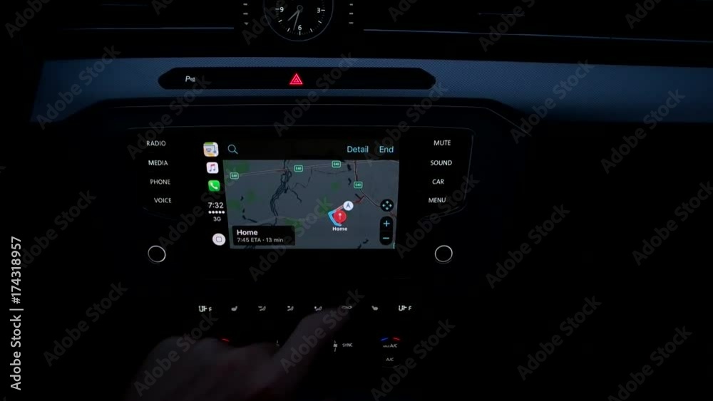 the guy uses the navigation in the car. the guy uses the navigation in the car.