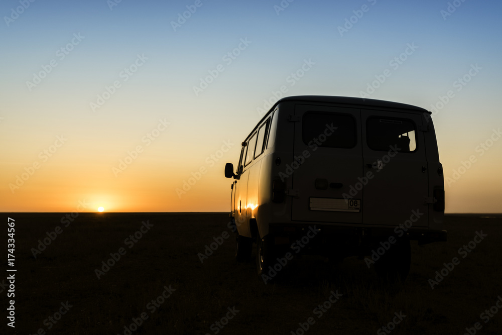 Vintage retro car in the red sunset of desert