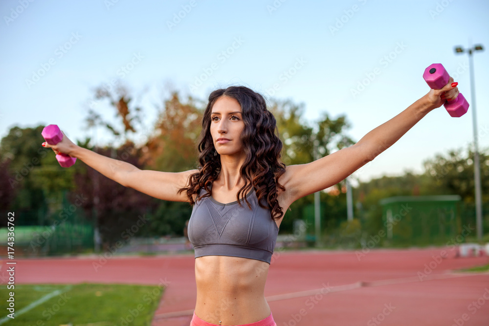 Woman with dumbbells