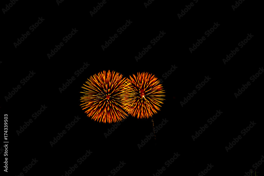Celebratory fireworks on the background of night city and the black sky. Celebratory fireworks on the background of night city and the black sky.