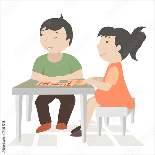 Children sit at the table and play a game