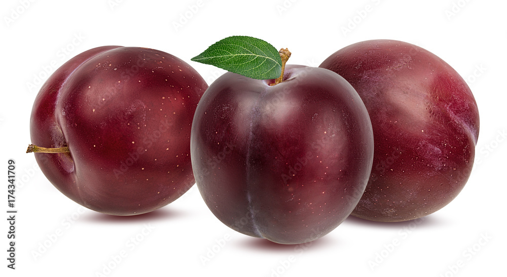 Three plums with leaf isolated on white background