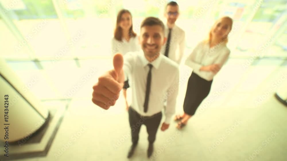 The business people thumb up to the camera. slow motion The business people thumb up to the camera. slow motion