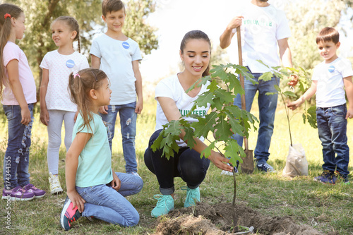 Young volunteers with child...