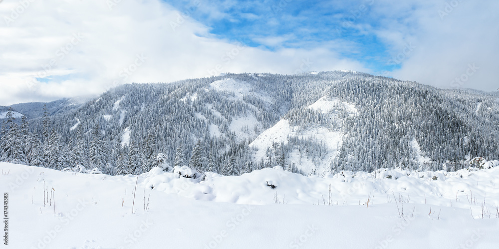 Beautiful lake Amut in taiga hills on Far East of Russia in early october. Mountain in winter. Beautiful nature. Snowy weather. Beautiful lake Amut in taiga hills on Far East of Russia in early october. Mountain in winter. Beautiful nature. Snowy weather.