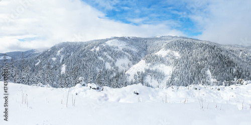Beautiful lake Amut in taiga hills on Far East of Russia in early october. Mountain in winter. Beautiful nature. Snowy weather.