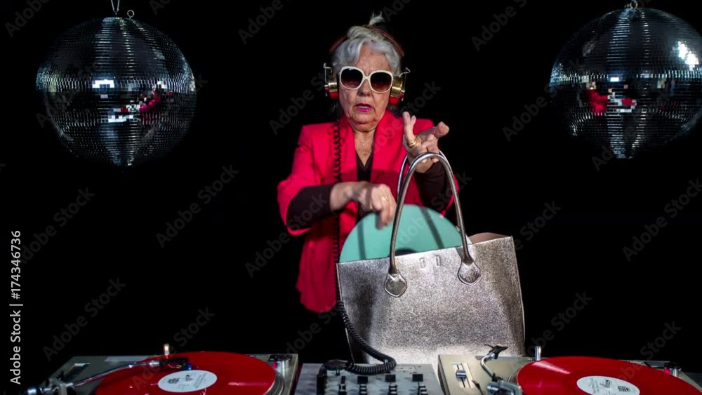 amazing DJ grandma, older lady djing and partying in a disco setting. these retired rockers will get the party going. this isa looped scratch version of the series