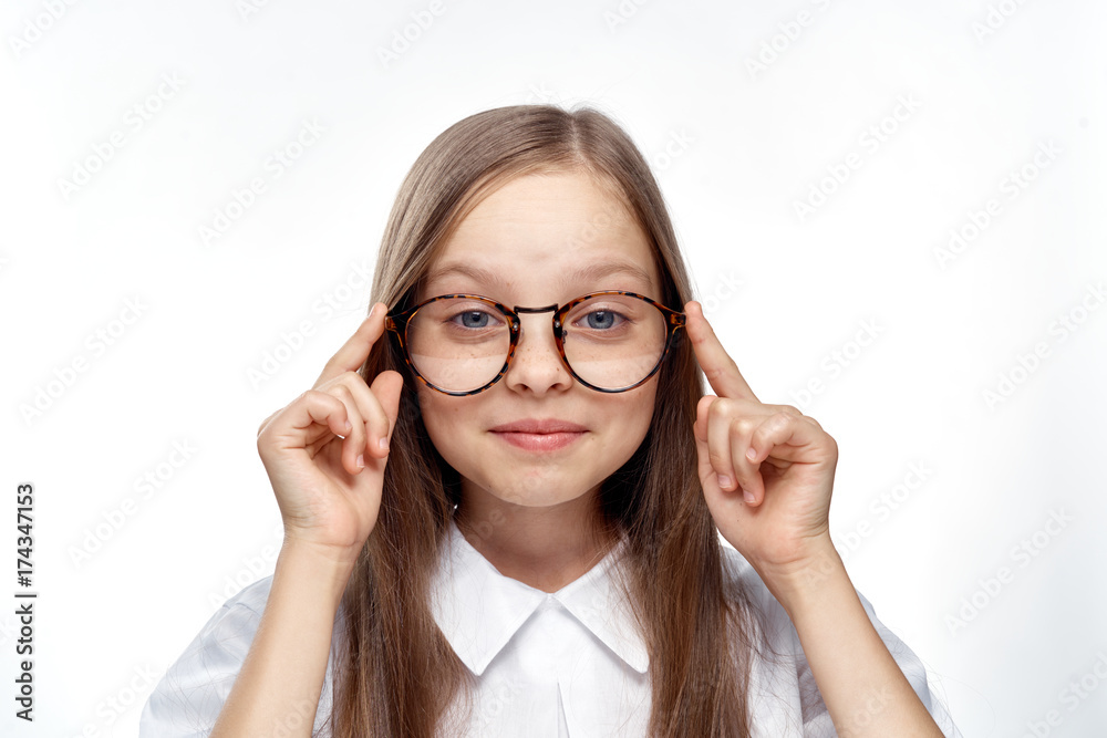 little girl with glasses on white isolated background, portrait, smile